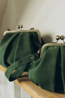 Bag with a green suede clasp