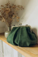 Bag with a green suede clasp