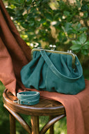 Bag with a green suede clasp