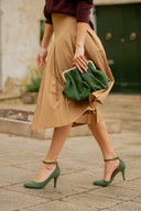Bag with a green suede clasp