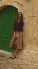 Bag with a green suede clasp